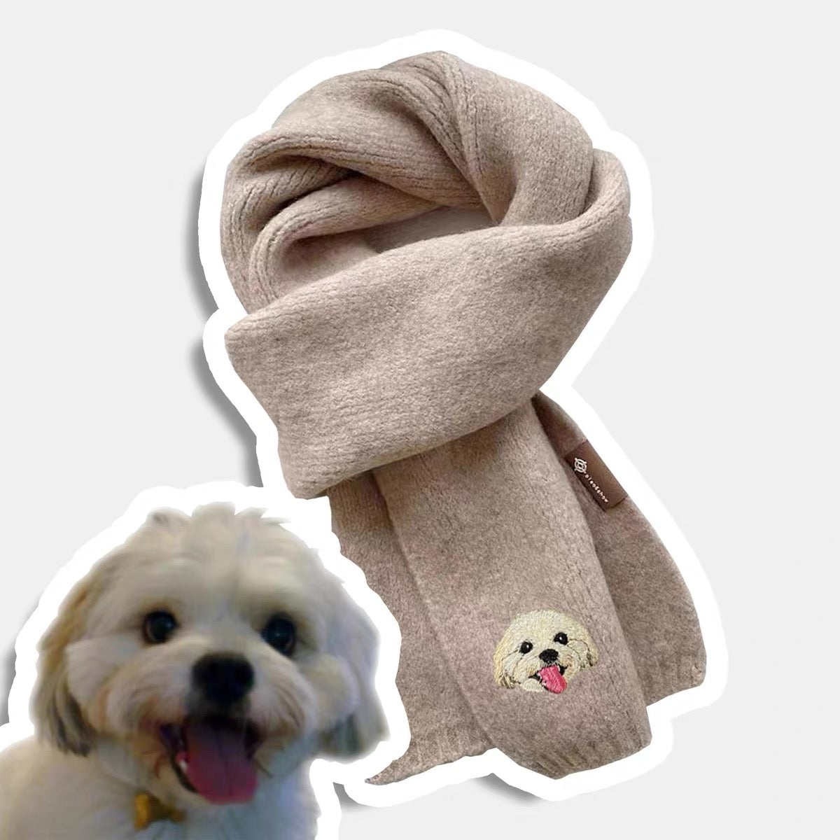 Beige scarf with embroidered dog face design on a white background